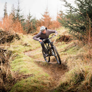 Tom riding a drop in a corner for Steep & Tech 