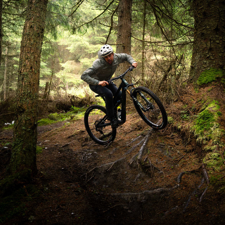 Tom taking the high line on a tech corner for steep & tech with Dirt School