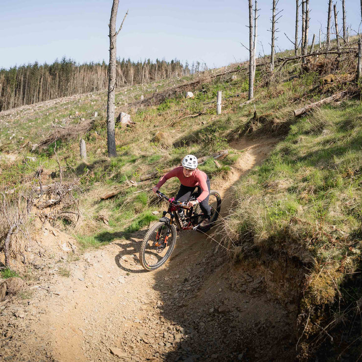 Fi riding her Bronson on the lower turns of the New Wolf Trail at the Golfie